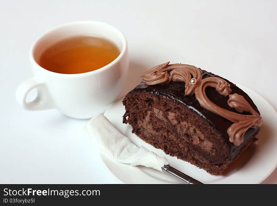 Cake on the dish, and cup of tea. Cake on the dish, and cup of tea