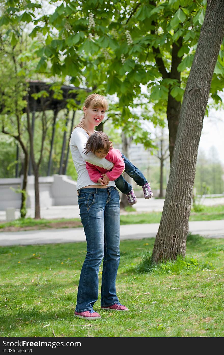 Mother and little daughter on nature. Happy people outdoors