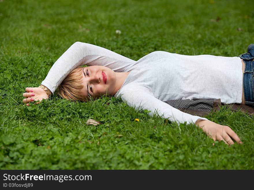 Pretty Woman Laying On The Grass