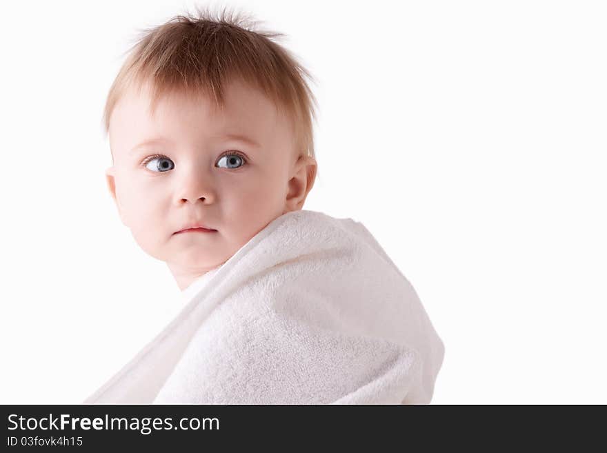 A little child in a towel on a white background. A little child in a towel on a white background