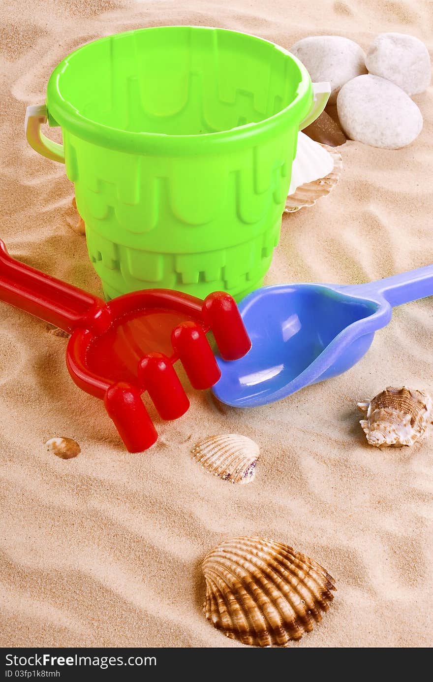 Children's toys - bucket, spade and shovel on sand. Children's toys - bucket, spade and shovel on sand