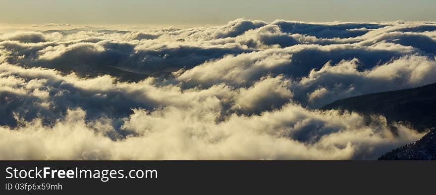 Clouds in mountains at sunrise