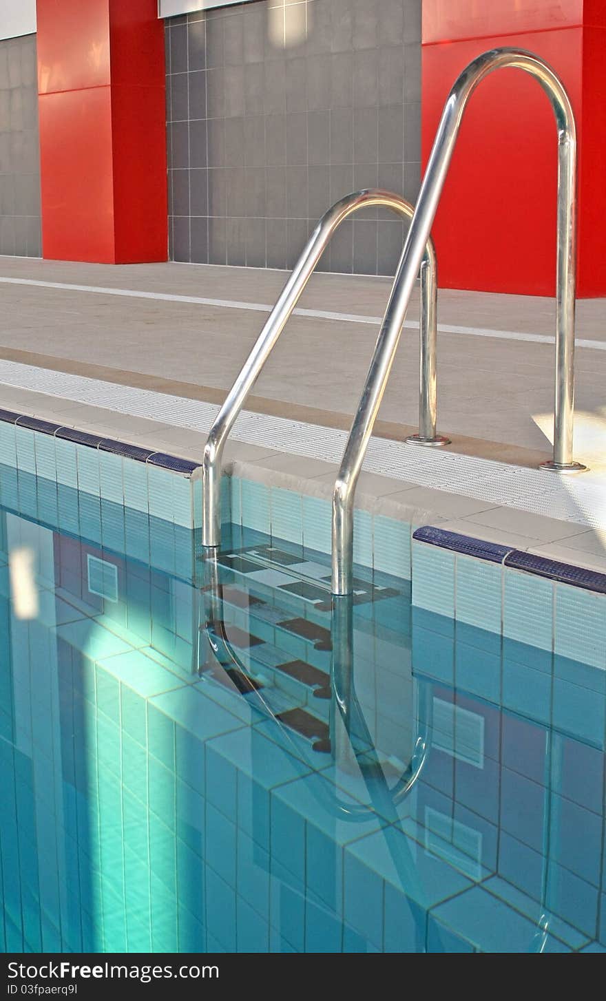 Ladder in a swimming pool with water