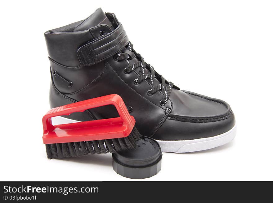 Shoe with polish and shoe brush