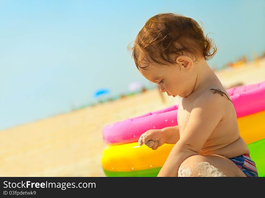 Little girl on the sand beach