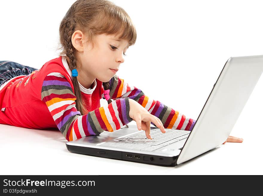 Portrait of a little girl with a laptop