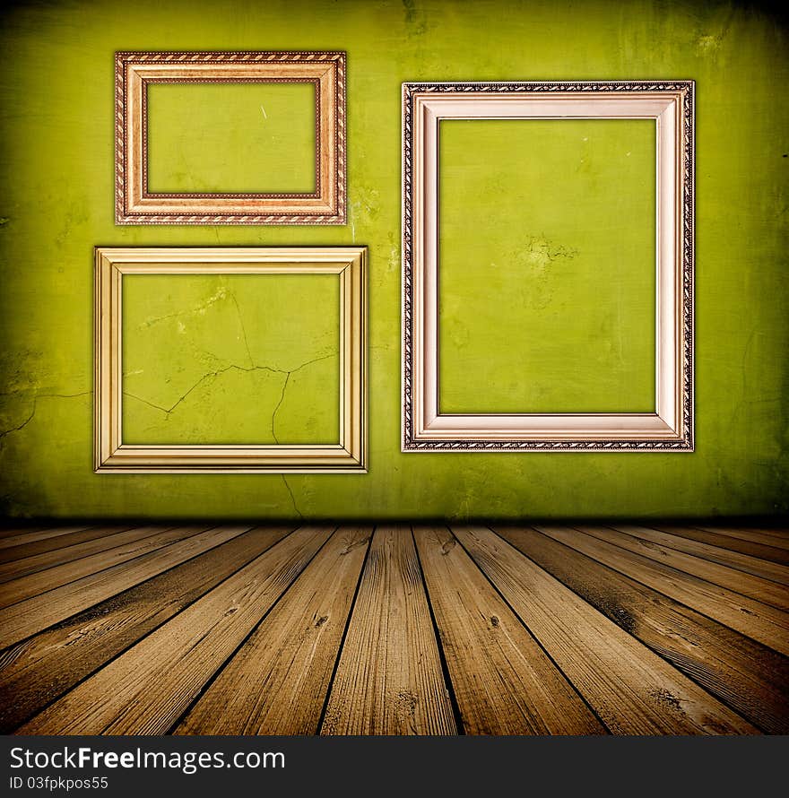 Vintage green interior with empty frame hanging on the wall. Vintage green interior with empty frame hanging on the wall