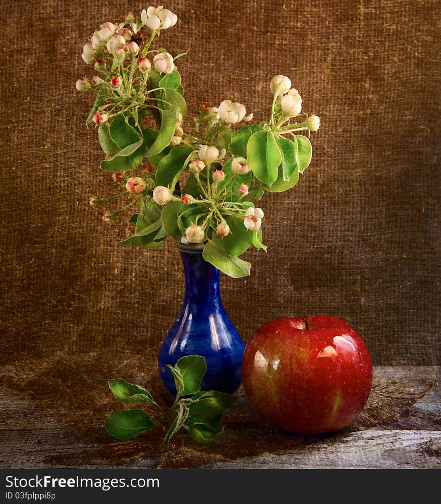 Flowers and apple