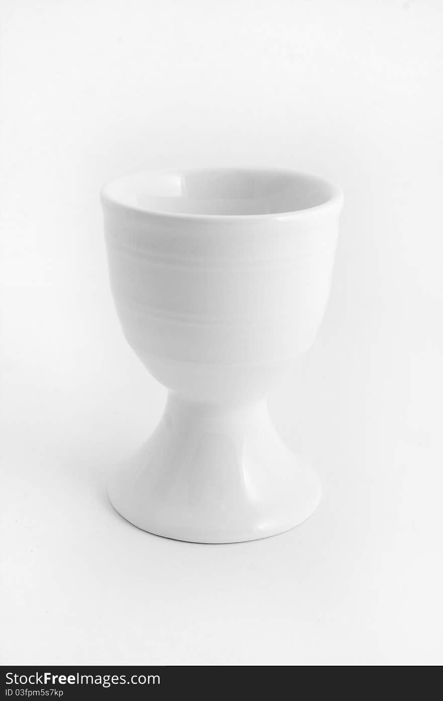 White egg cup isolated over white. White egg cup isolated over white