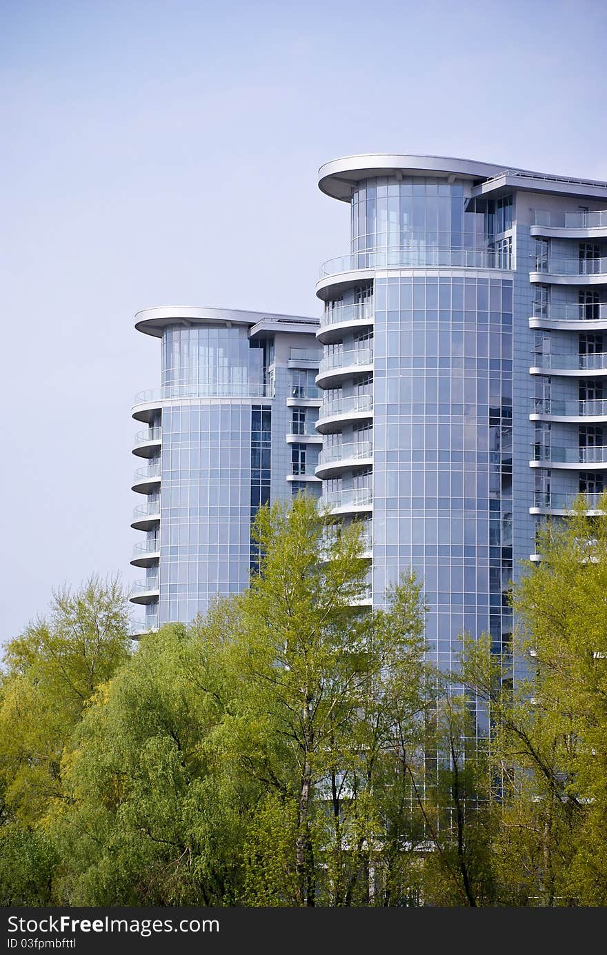 Modern building and green trees in Kiev.Ukraine. Modern building and green trees in Kiev.Ukraine