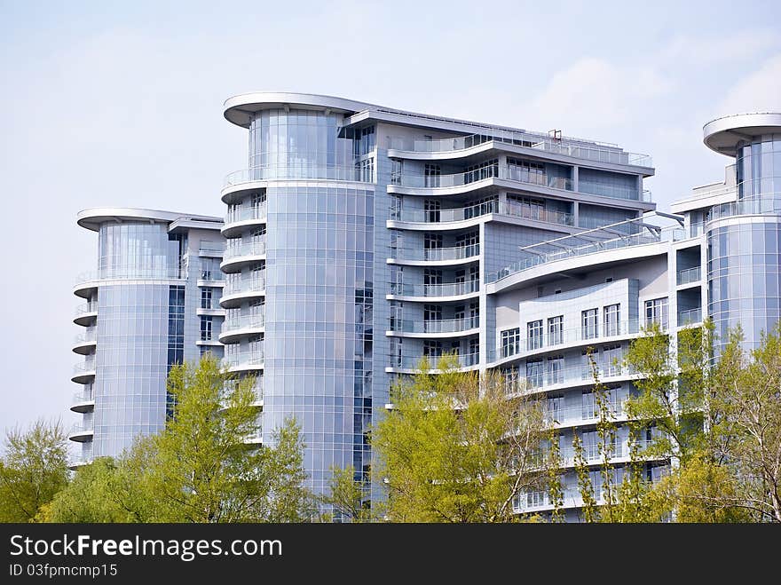 Modern building and green trees in Kiev.Ukraine. Modern building and green trees in Kiev.Ukraine