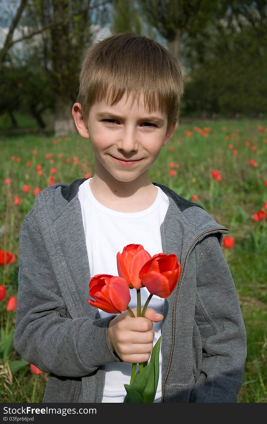 Boy with bouquet of tulips