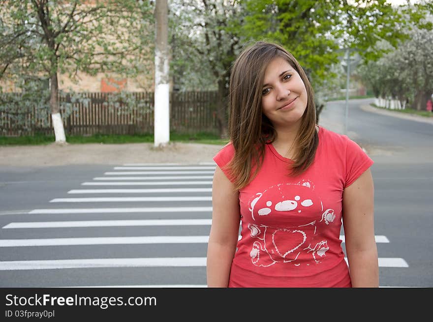 Teen girl crossing the road