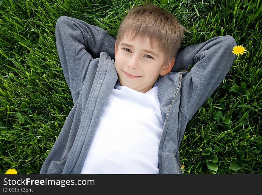 Boy on the green grass