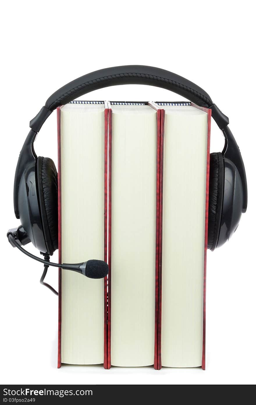 Three books wear headphone