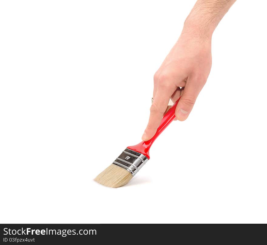 Human hand with a brush painting on a white background. Human hand with a brush painting on a white background