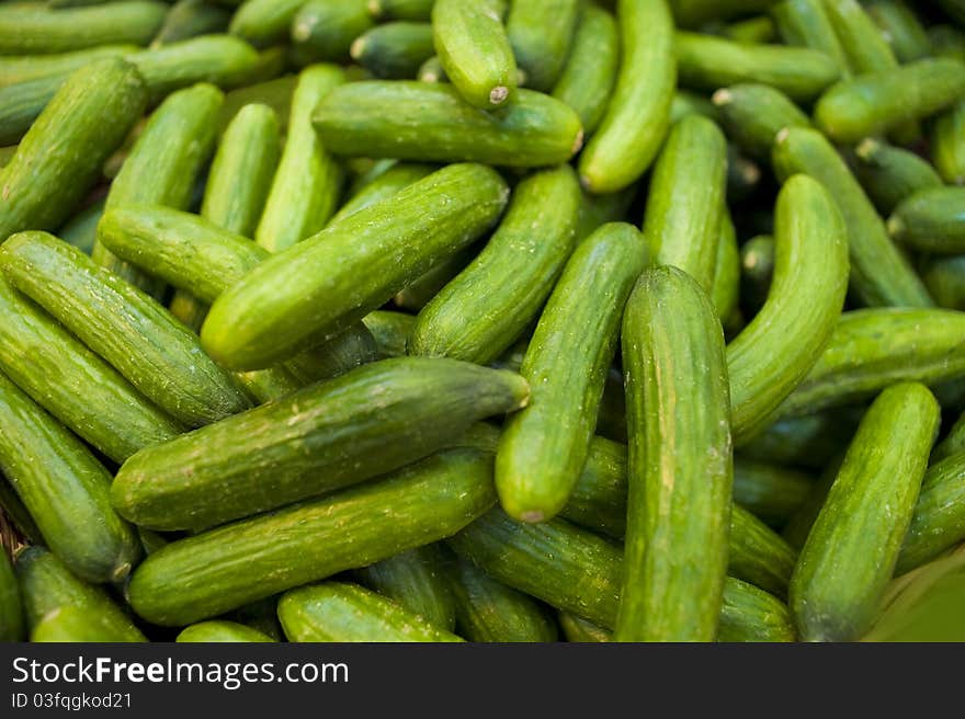 Cucumbers bunched together For Sale At Market good as a background