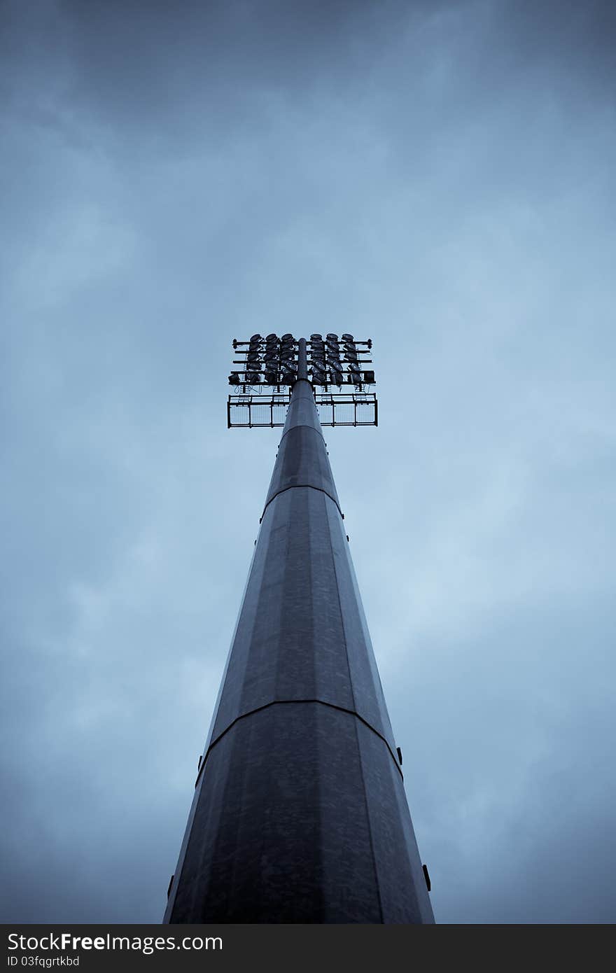 Stadium light pole on a cloudy evening