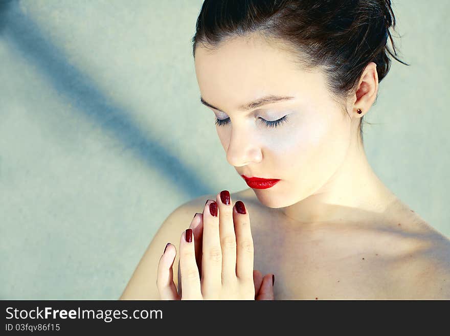 Beautiful girl with red lips consecrated hands. Beautiful girl with red lips consecrated hands