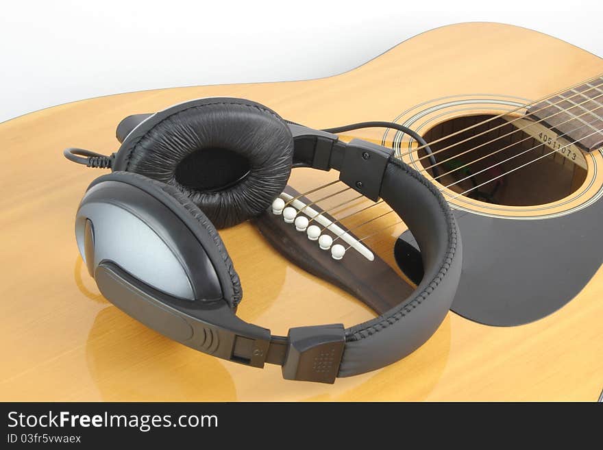 Headphone on guitar for leisure time