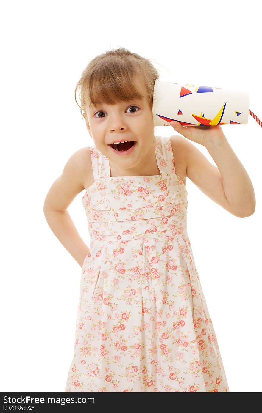 Surprised beautiful little girl in summer dress calling by telephone - paper glass with cable. Surprised beautiful little girl in summer dress calling by telephone - paper glass with cable