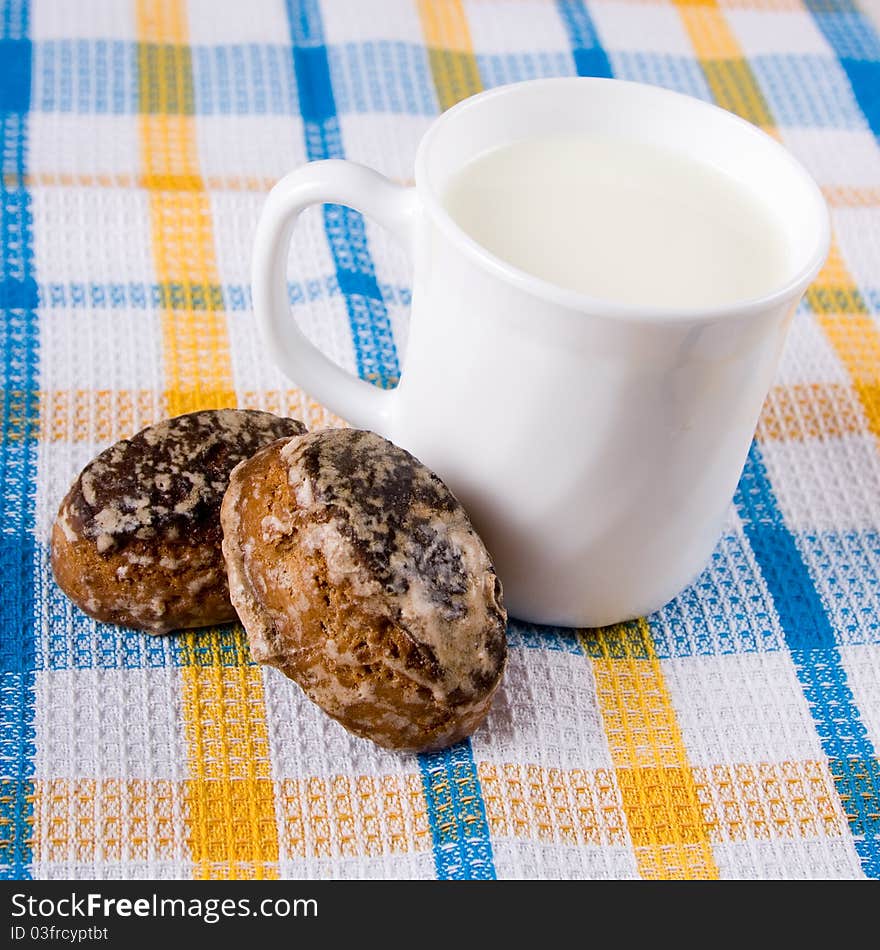 Milk and chocolate cakes on a checkered napkin