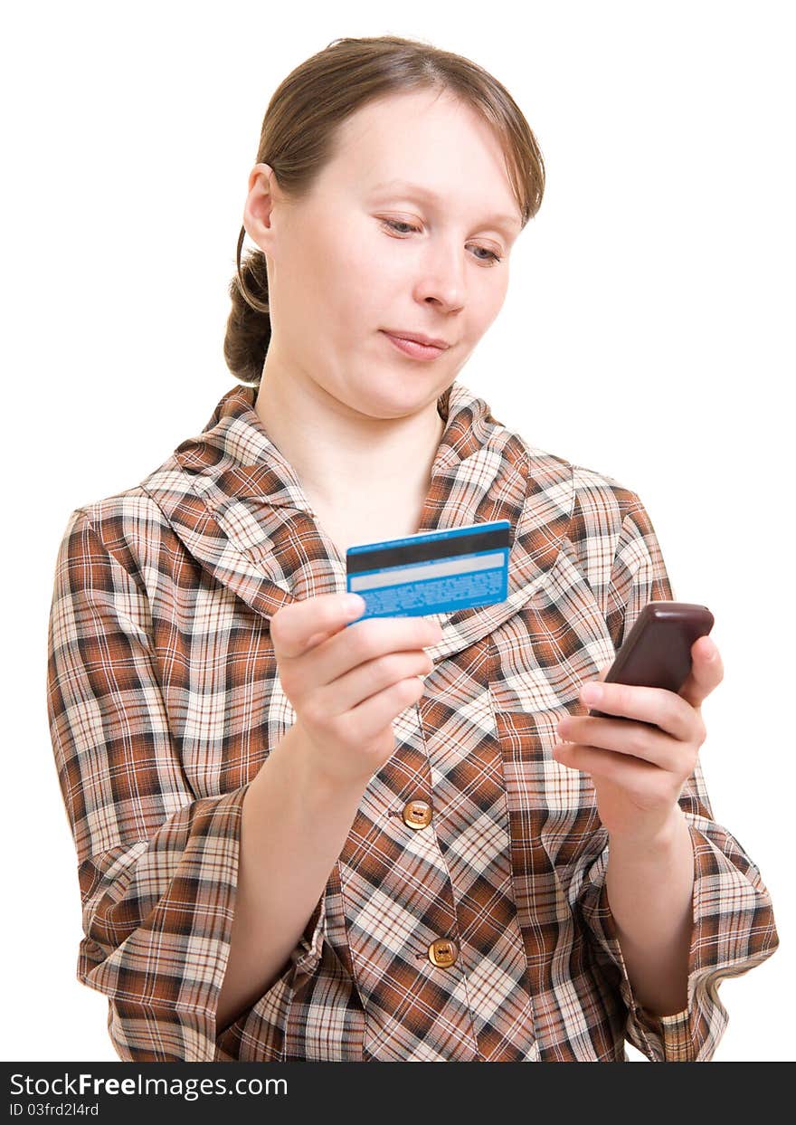 Girl with a phone and a debit card. Girl with a phone and a debit card