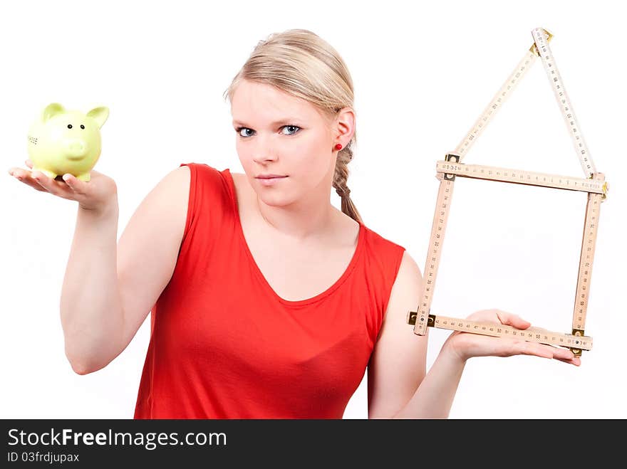 Young Woman With House Symbol And Piggy Bank