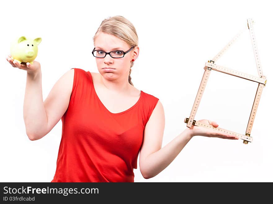 Young Woman With House Symbol And Piggy Bank