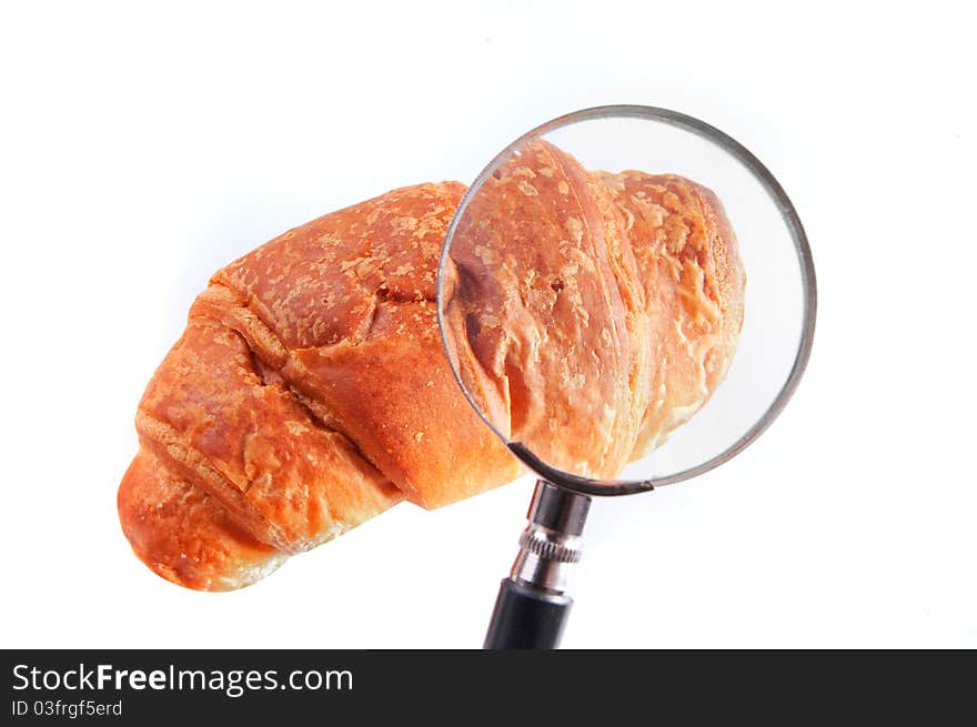 Fresh delicious croissant isolated over white background