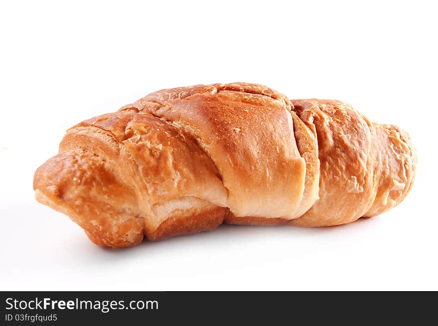 Fresh delicious croissant isolated over white background