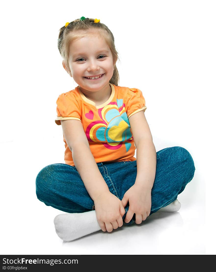 Beautiful little girl smiling on a white background. Beautiful little girl smiling on a white background