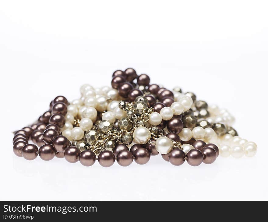 Heap of different necklaces on white background. Heap of different necklaces on white background