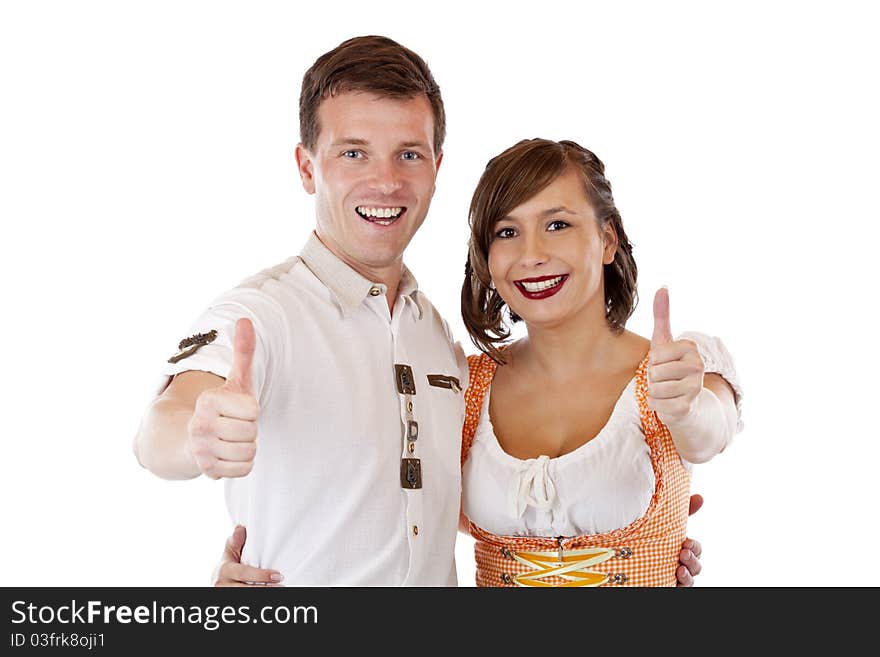 Bavarian man and woman showing thumbs up