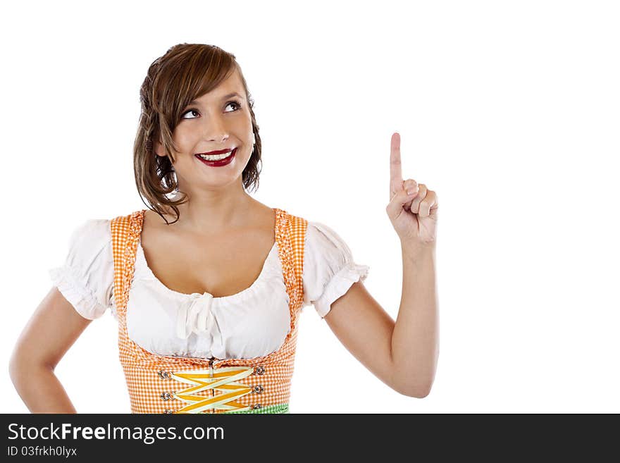 Beautiful girl with oktoberfest dirndl points up to ad space.Isolated on white background. Beautiful girl with oktoberfest dirndl points up to ad space.Isolated on white background.