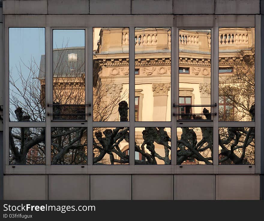 Historical architecture (Hessen State Theatre) reflected in a modern 1980's building window. Historical architecture (Hessen State Theatre) reflected in a modern 1980's building window.