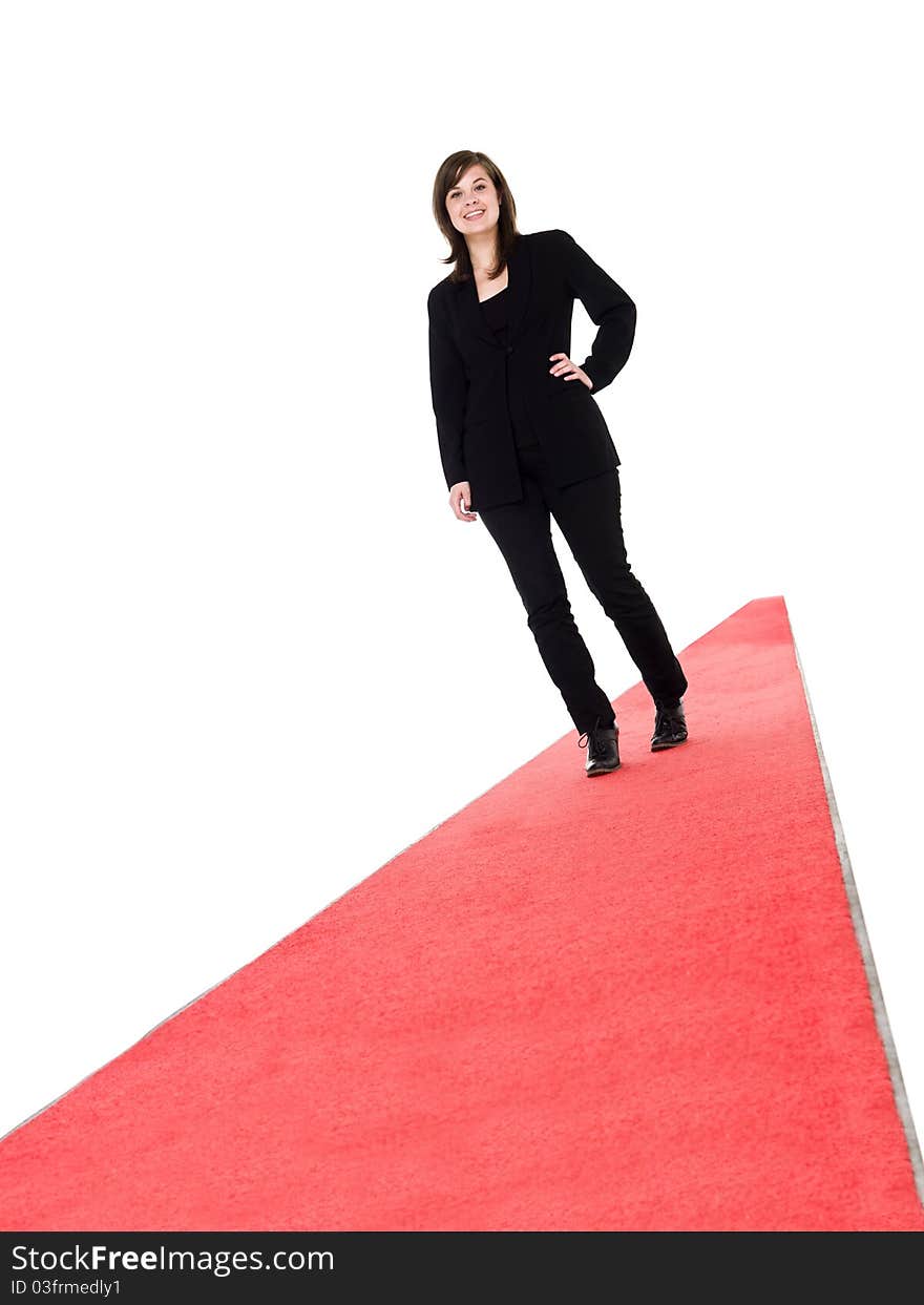 Smiling girl walking on red carpet