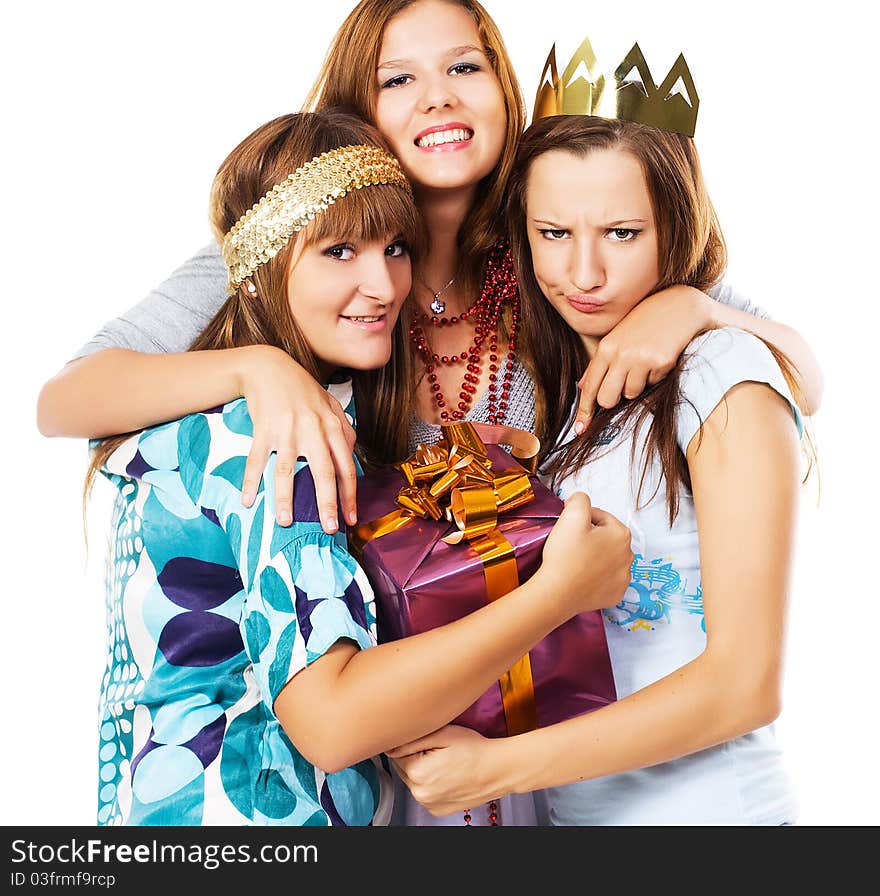 Happy teenage friends with a gift box against whit background