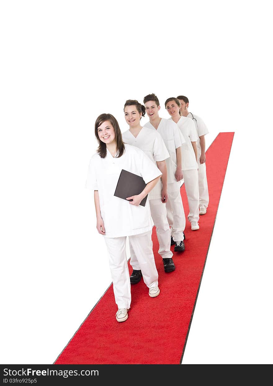 Medical Team on a red Carpet isolated on white background