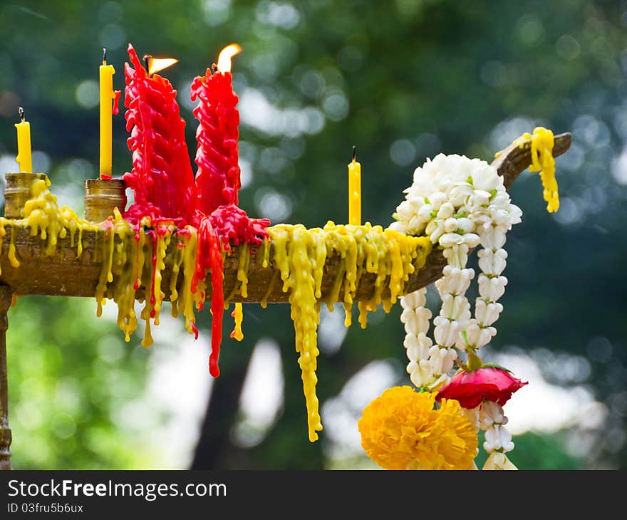 Candles and Lei of Flowers for Worship