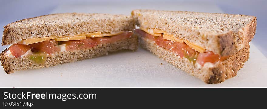 Tomato sandwich with cheese on whole wheat bread