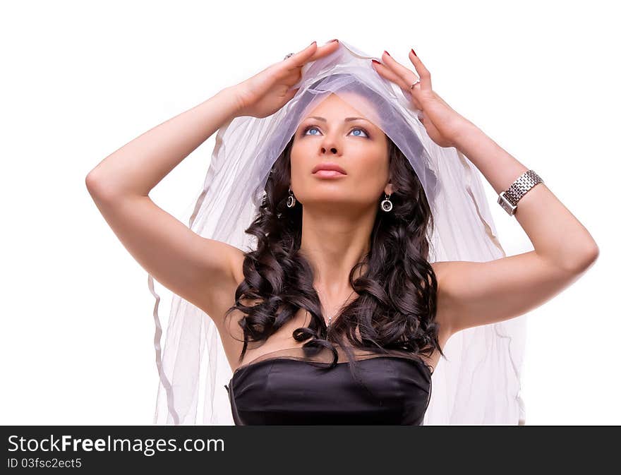 Beautiful young woman in a black dress and veil. Beautiful young woman in a black dress and veil