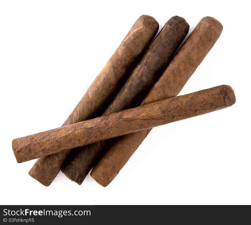 Four cigars on a white background.