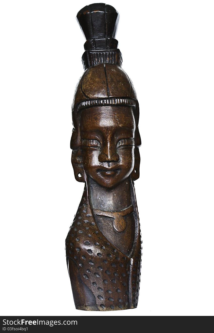 Wood carving of a female face.