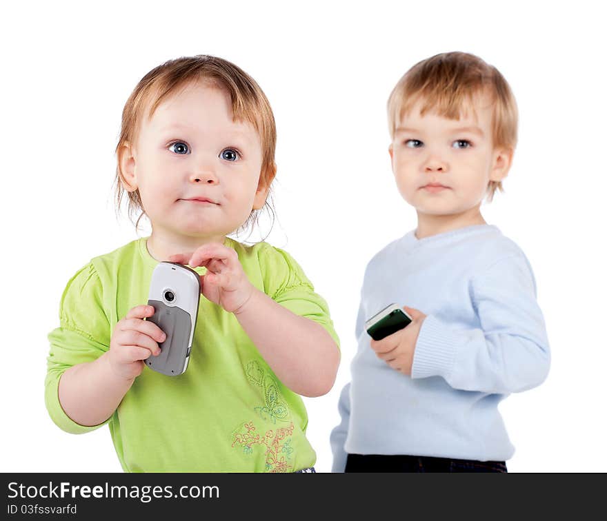 Isolated surprised little girl and boy the phone