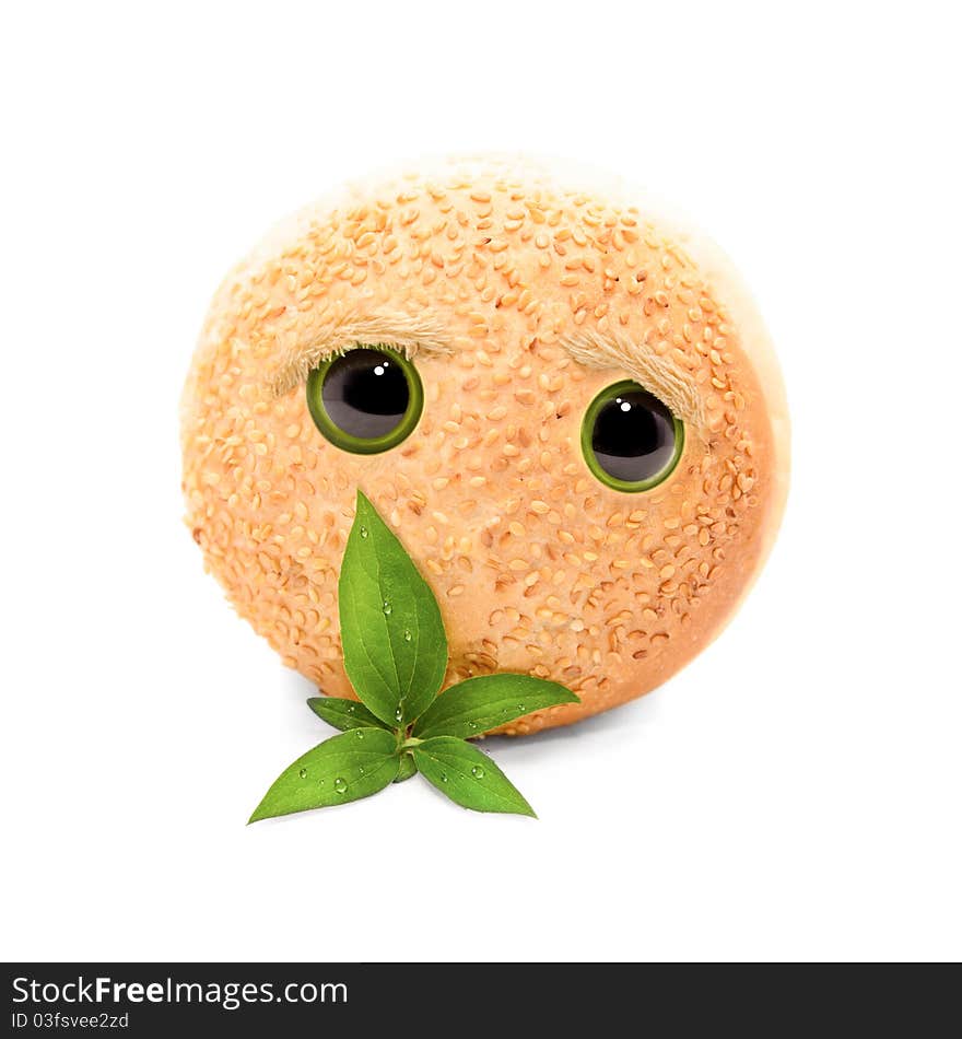 Round bread with sesame and with a leaf sprinkled with water isolated on white background. Round bread with sesame and with a leaf sprinkled with water isolated on white background