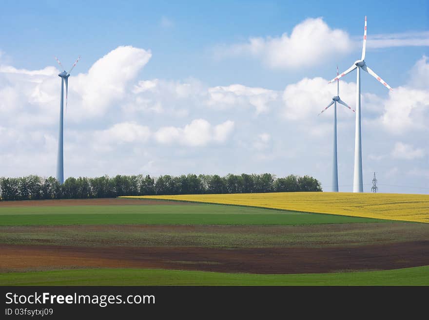 Spring landscape with wind turbine towers. Spring landscape with wind turbine towers.