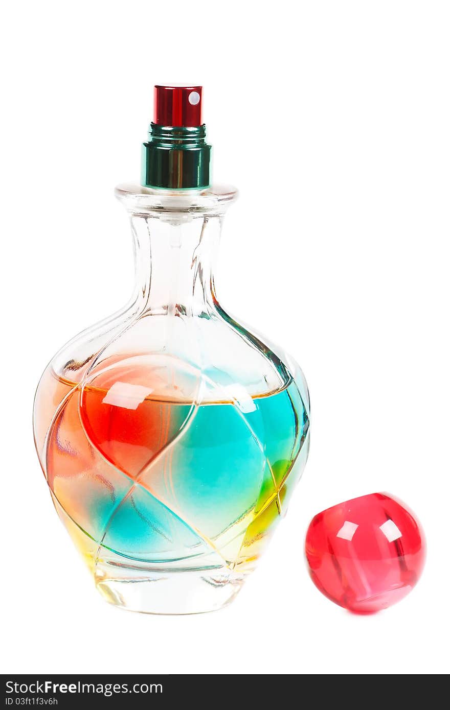 Colorful perfume bottle over white background