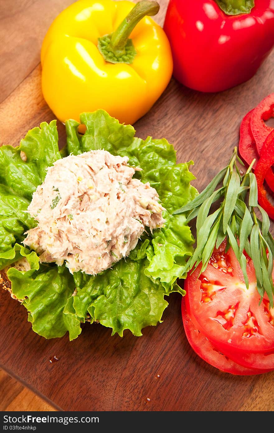 Tuna fish sandwich on multigrain bread with lettuce and tomato. Tuna fish sandwich on multigrain bread with lettuce and tomato