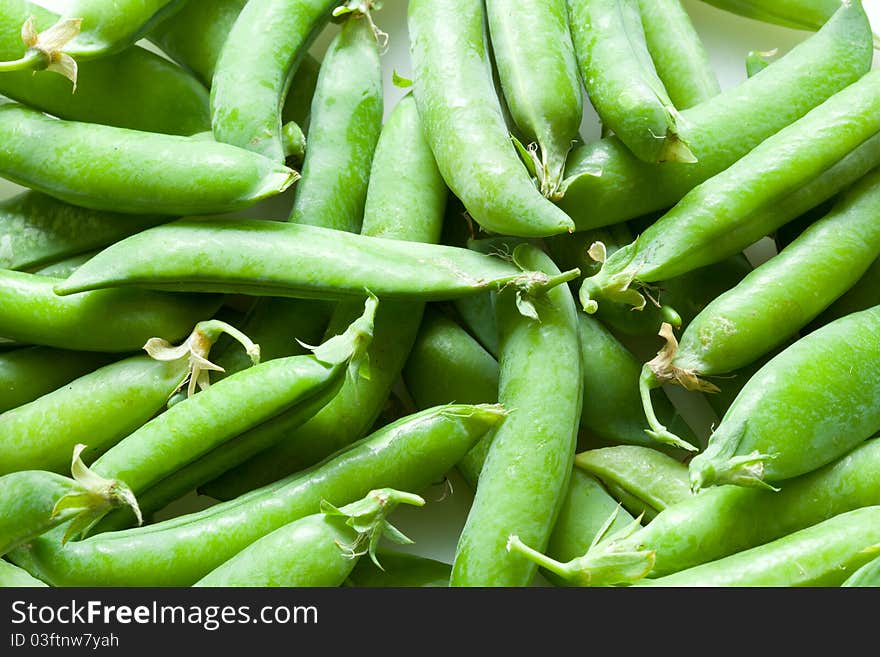 A lot of fresh green peas close up